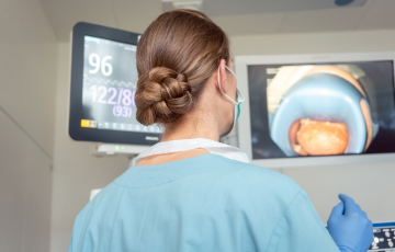 female physician looking at magnified image of endoscopy 
