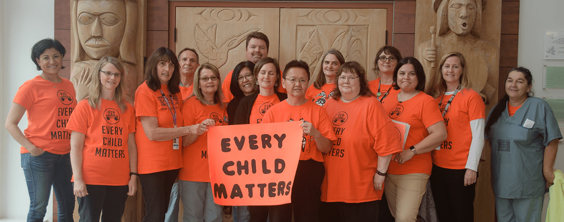 Staff wear orange t-shirts in support of Every Child Matters