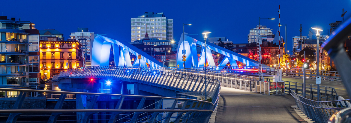 Image of the Johnson Street Bridge at night in Victoria, British Columbia