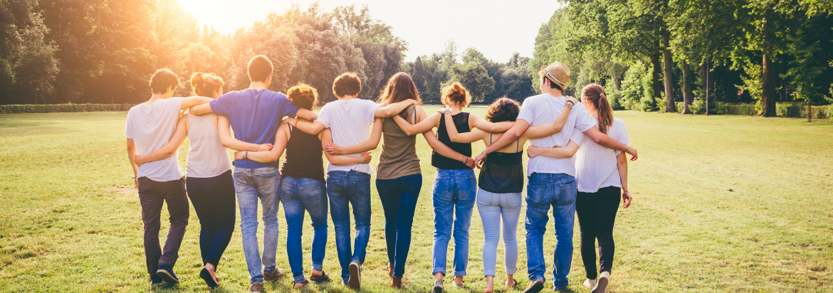 people walking holding arms around each other