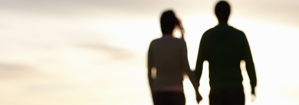 silhouette of couple holding hands 