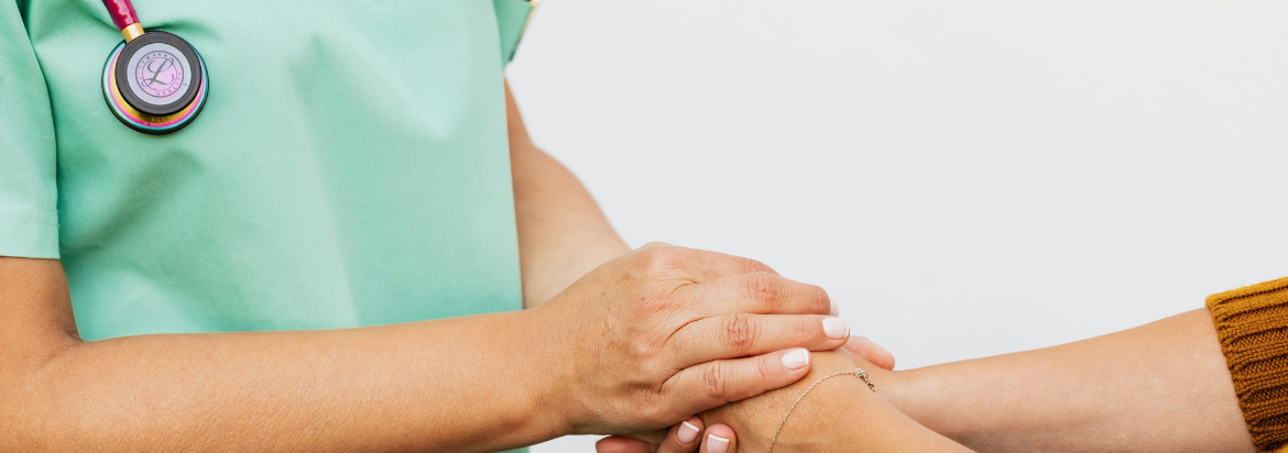 doctor and patient holding hands