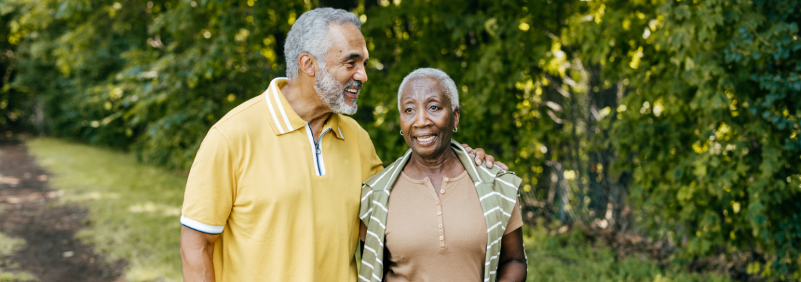 two people walking and smiling