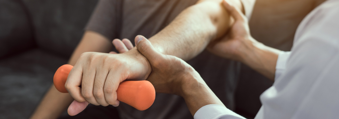 provider helping patient lift weight