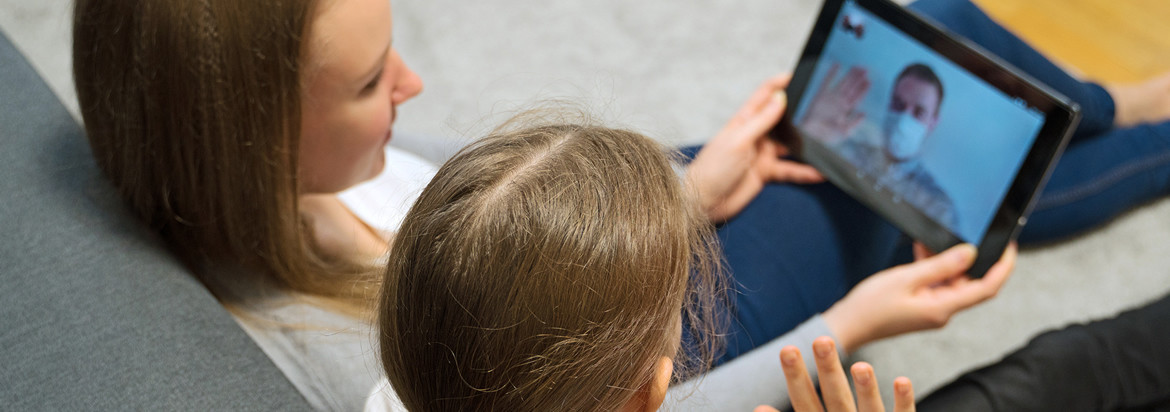 woman and child using tablet