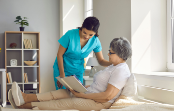 image of residential care worker assisting patient