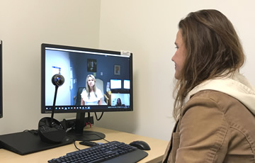 woman sitting in front of a computer