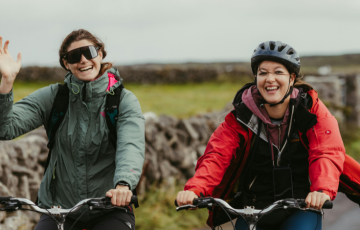 Two people cycling