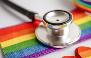 pride flag with a stethoscope