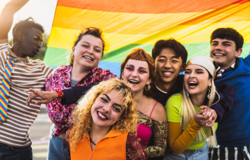 group of young people celebrating pride