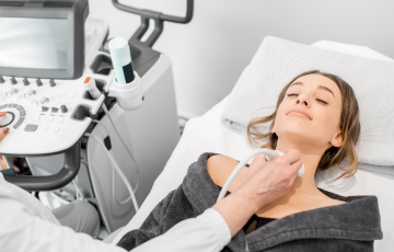 person receiving ultrasound on neck