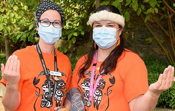 People wearing orange shirts for Orange Shirt Day 2020