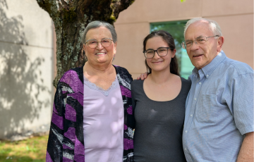 Helen Dyck, her granddaughter and husband Ross 