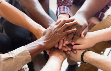 image of people holding hands