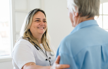 Health Career Assistant aiding a patient