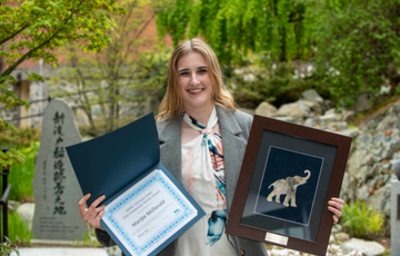 Marijke McDonald holding her award