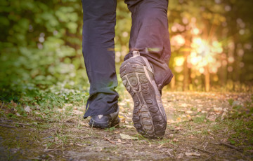 person walking on trail 