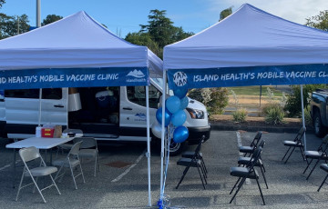 A booth with tents at a vaccination clinic.