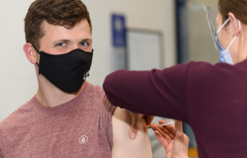 young person getting immunized 