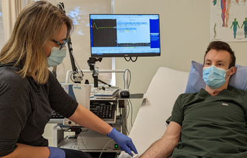 Neuro Electrodiagnostic Technologist Kirstine Macaskill performs nerve conduction studies to measure the electrical activity of nerves