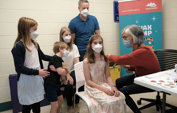 Child getting immunized at an Island Health facility