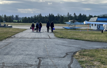 people walking from helicopter