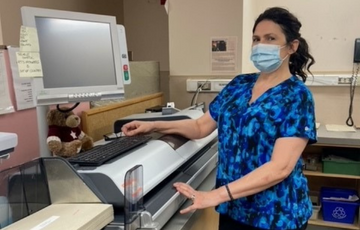 Sylvia Erickson sorts mail at NRGH