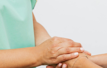 holding hands with practitioner