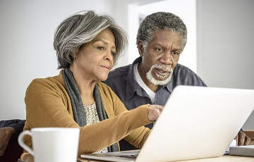 Senior couple on computer