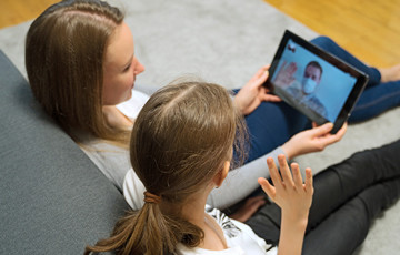 woman and child using tablet