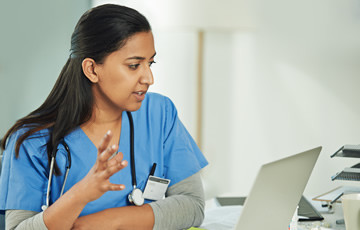female care provider using laptop