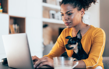 woman using laptop at home